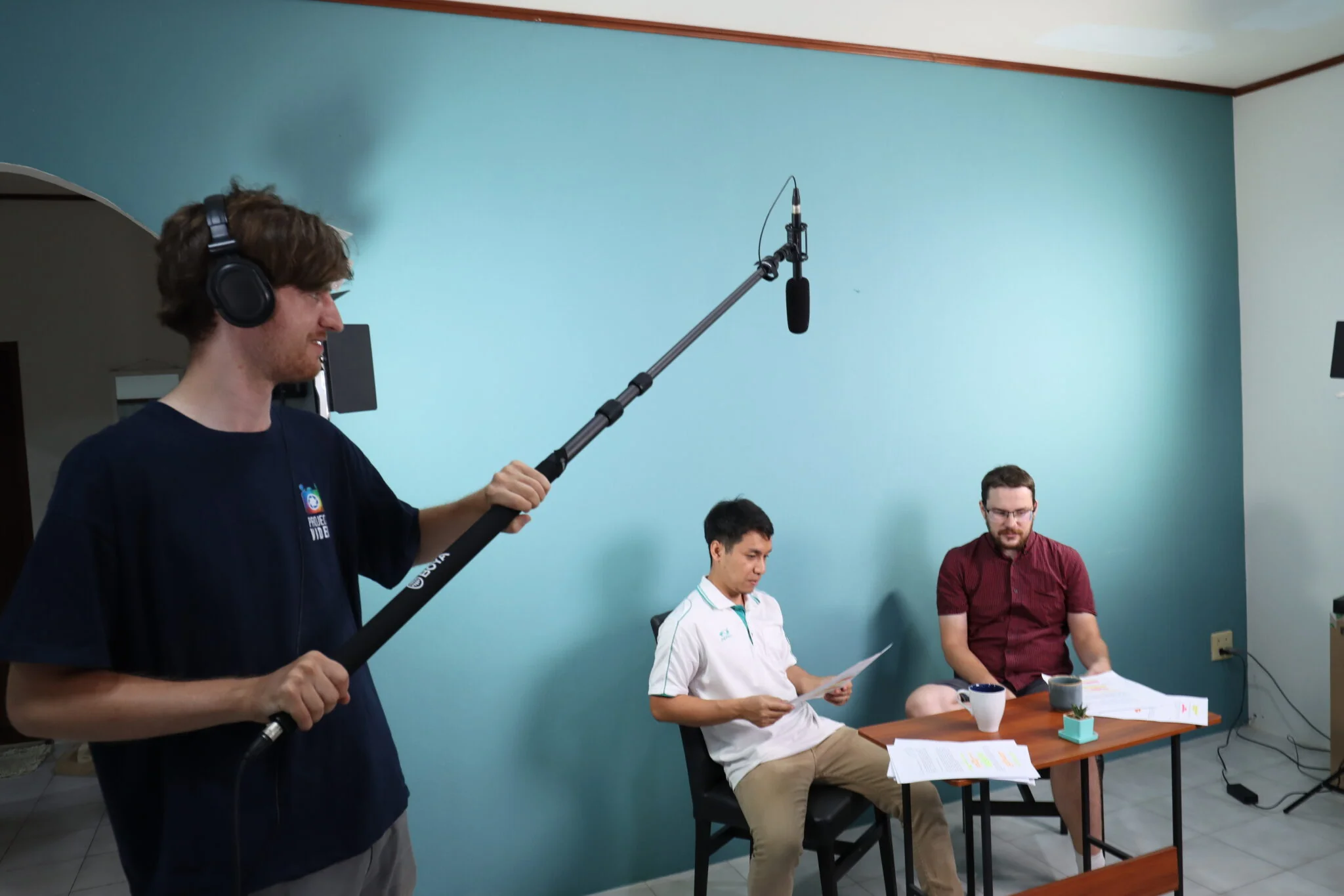 Students filming a documentary interview